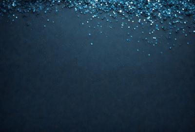 The primary subject of the image is a blue background with a pattern of blue glittery stars. The setting is a dark blue background, and the visual style appears to be a digital art or illustration. The colors and mood of the image are predominantly dark and moody, with the blue glittery stars adding a touch of brightness and visual interest.