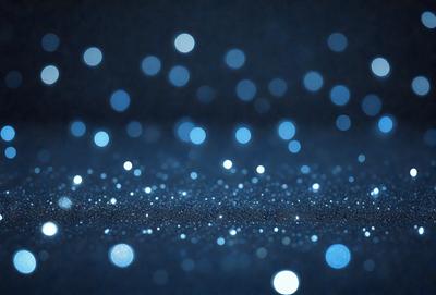 The primary subject of the image is a blue background with a pattern of white lights. The setting appears to be a dark room, and the visual style is a combination of a photo and digital art. The dominant colors are blue and white, creating a calm and serene atmosphere.
