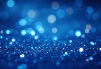The primary subject of the image is a blue background with a pattern of bright, shiny, and sparkling lights. The setting appears to be a dark, starry night, with the lights creating a mesmerizing and captivating visual effect. The visual style of the image is a combination of a photo and digital art, as it captures the beauty of the night sky with the sparkling lights. The colors and mood of the image are predominantly blue, with the bright lights adding a touch of warmth and energy to
