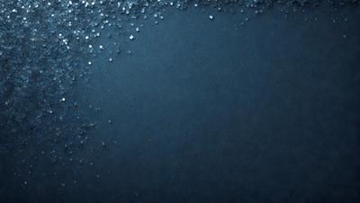 The primary subject of the image is a blue background with a few white specks. The setting appears to be a dark room, and the visual style is a close-up of the blue background. The colors and mood of the image are predominantly dark and moody, with the blue background and white specks creating a sense of depth and contrast.
