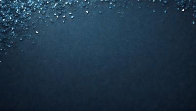 The primary subject of the image is a blue background with a pattern of glittering blue and white stars. The setting is a dark blue sky, and the visual style appears to be a digital art or illustration. The colors and mood of the image are predominantly dark and moody, with the blue and white stars adding a touch of brightness and contrast.