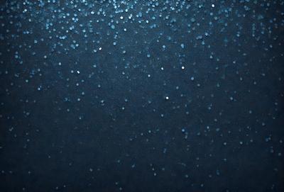 The primary subject of the image is a blue background with a pattern of white stars. The setting appears to be a night sky, and the visual style is a combination of a photo and digital art. The dominant colors are blue and white, creating a serene and peaceful atmosphere.