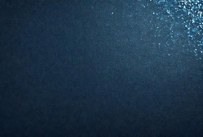 The primary subject of the image is a dark blue background with a few small white specks. The setting is a night sky, and the visual style is a photo. The colors and mood of the image are dark and moody, with the blue background and white specks creating a sense of depth and contrast.