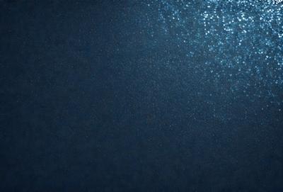 The primary subject of the image is a blue ocean with a few ripples. The setting is underwater, with the ocean floor visible. The visual style is a photo of the ocean, capturing the beauty of the blue water and the ripples. The colors and mood of the image are predominantly blue, creating a serene and calming atmosphere.