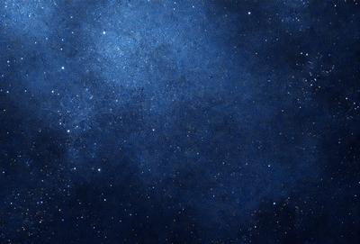 The primary subject of the image is the night sky, which is filled with stars. The setting is a dark, star-filled sky, and the visual style is a photo of the night sky. The colors and mood of the image are predominantly dark and serene, with the stars providing a sense of depth and beauty.