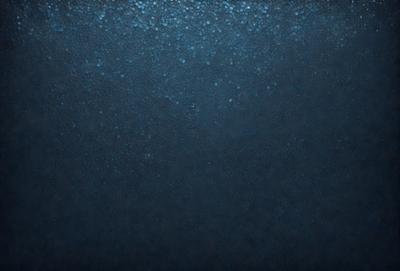 The primary subject of the image is a large body of water, which appears to be a deep blue ocean. The setting is a vast expanse of water, with no visible land or other objects in the background. The visual style of the image is a close-up of the water, showcasing its depth and beauty. The colors and mood of the image are predominantly blue, creating a serene and tranquil atmosphere.