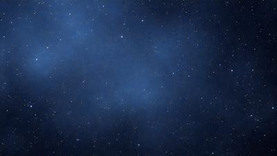 The primary subject of the image is the night sky, which is filled with stars. The setting is a dark, star-filled sky, and the visual style is a photo. The colors and mood of the image are predominantly dark and serene, with the stars providing a sense of depth and beauty.