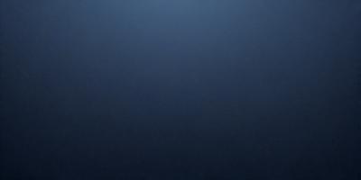 The primary subject of the image is a dark blue sky. The setting is a vast, open space with no visible landmarks or objects. The visual style is a simple, monochromatic image with no additional elements or textures. The colors and mood convey a sense of calmness and tranquility.