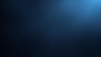 The primary subject of the image is a blue sky with a few clouds. The setting is a dark blue background, which creates a contrasting effect with the sky. The visual style is a photo, capturing the beauty of the sky and clouds. The colors and mood of the image are predominantly dark and moody, with the blue sky and clouds providing a sense of depth and tranquility.