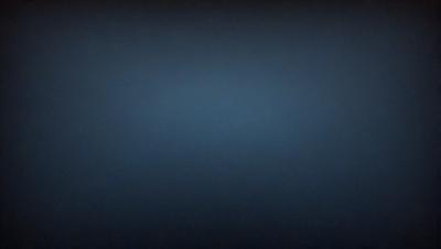 The primary subject of the image is a blue sky with no clouds. The setting is a dark, empty sky, and the visual style is a photo. The colors and mood of the image are predominantly dark and moody, with the blue sky being the main focus.