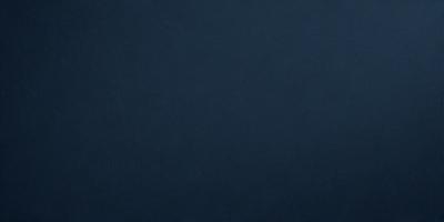 The primary subject of the image is a dark blue background. The setting is a blank canvas, with no visible objects or details. The visual style is a simple, monochromatic design. The colors and mood are predominantly dark and moody, with a hint of mystery.