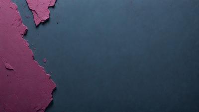 The primary subject of the image is a large, dark blue surface with a pinkish hue. The setting appears to be a dark room, and the visual style is a close-up of the blue surface. The colors and mood of the image are predominantly dark and moody, with the blue surface contrasting against the pinkish hue.