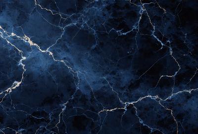 The primary subject of the image is a blue marble wall with a pattern of gold streaks. The setting is a dark room, and the visual style is a close-up of the marble wall. The colors and mood of the image are predominantly dark and moody, with the blue marble and gold streaks creating a striking contrast against the dark background.