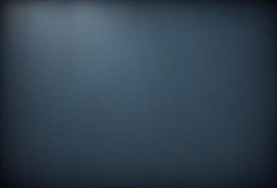 The primary subject of the image is a blue wall. The setting is a room with a blue wall, and the visual style is a photo. The dominant colors are blue, and the overall atmosphere is calm and serene.