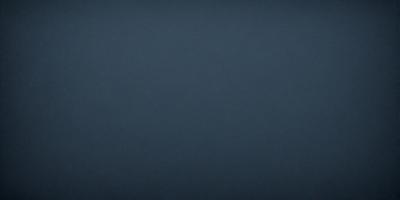 The primary subject of the image is a large, dark blue surface. The setting is a vast, empty space with no visible objects or backdrop. The visual style is a simple, monochromatic design. The colors and mood are predominantly dark and moody, with a hint of mystery.