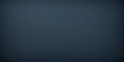 The primary subject of the image is a large, dark blue surface. The setting is a vast, empty space with no visible objects or backdrop. The visual style is a simple, monochromatic design. The colors and mood are predominantly dark and moody, with the blue surface creating a sense of depth and mystery.