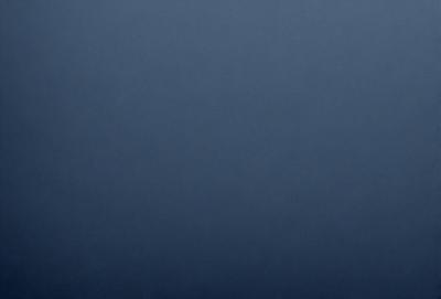 The primary subject of the image is a dark blue sky. The setting is a cloudy day, with no visible landmarks or objects. The visual style is a natural, outdoor scene. The colors and mood are predominantly dark and moody, with the blue sky being the main focus of the image.