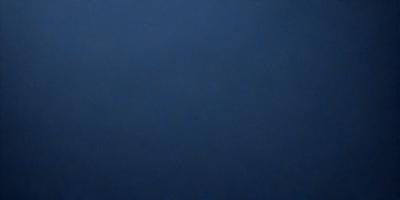 The primary subject of the image is a large, dark blue surface. The setting is a vast, empty space with no visible objects or backdrop. The visual style is a simple, monochromatic design. The dominant colors are shades of blue, creating a calm and serene atmosphere.