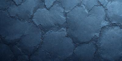 The primary subject of the image is a blue surface with a pattern of holes or bumps. The setting appears to be a wall or a similar surface, and the visual style is a close-up of the blue surface. The dominant colors are blue and grey, creating a calm and soothing atmosphere.