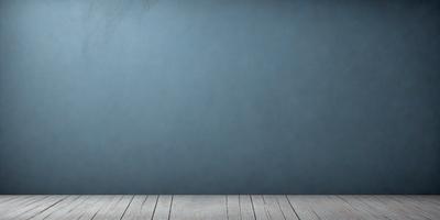 The primary subject of the image is a blue wall with a wooden floor. The setting is a room with a blue wall and a wooden floor. The visual style is a photo, and the dominant colors are blue and wood. The overall atmosphere is calm and serene.
