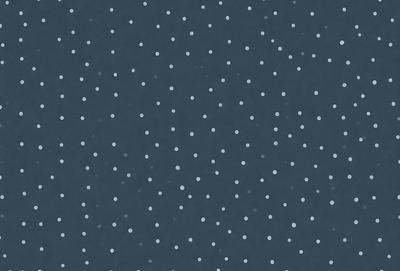 The primary subject of the image is a pattern of white dots on a blue background. The setting is a dark blue sky, and the visual style appears to be a digital art or illustration. The colors and mood of the image are predominantly dark and moody, with the white dots contrasting against the blue background.