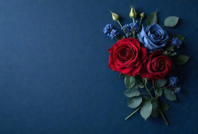 The primary subject of the image is a bouquet of red and blue roses. The setting is a blue background, which creates a striking contrast with the vibrant colors of the flowers. The visual style is a close-up of the bouquet, showcasing the details of the roses. The colors and mood of the image are lively and cheerful, with the red and blue roses symbolizing love and passion.
