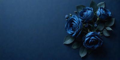 The primary subject of the image is a bouquet of blue flowers. The flowers are arranged in a vase, and they are placed against a dark blue background. The visual style of the image is a photo, capturing the beauty of the flowers in their natural setting. The colors and mood of the image are predominantly dark and moody, with the blue flowers standing out against the dark blue background.