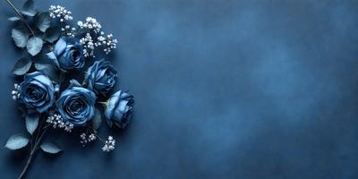 The primary subject of the image is a bouquet of blue flowers. The flowers are arranged in a visually appealing manner, with some of them placed on a blue surface. The setting appears to be a dark room, which adds a sense of depth and mystery to the scene. The visual style of the image is a close-up of the flowers, emphasizing their beauty and details. The colors and mood of the image are predominantly blue, creating a calm and serene atmosphere.