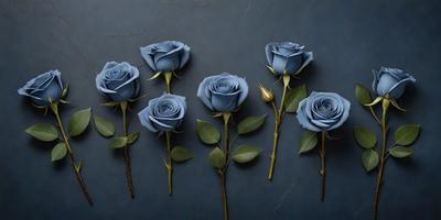 The primary subject of the image is a bouquet of blue roses. The setting is a dark blue background, which creates a dramatic and moody atmosphere. The visual style is a photo, capturing the beauty of the blue roses in their natural environment. The colors and mood of the image are predominantly dark and mysterious, with the blue roses standing out as the focal point.