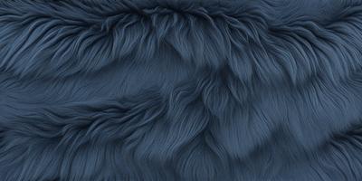The primary subject of the image is a blue, furry fabric. The setting is a close-up of the fabric, showcasing its texture and color. The visual style is a detailed, up-close view of the fabric. The colors and mood of the image are predominantly blue, giving it a calm and serene atmosphere.