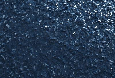 The primary subject of the image is a blue background with a pattern of glittering stars. The setting appears to be a night sky, and the visual style is a combination of a photo and digital art. The colors are predominantly blue, with the stars adding a touch of white. The overall atmosphere is one of beauty and tranquility.