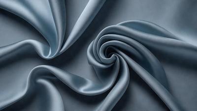 The primary subject of the image is a blue fabric, which is the main object, scene, or focus of the image. The setting or background is a blue surface, and the visual style is a photo. The dominant colors and overall atmosphere are blue and calm.