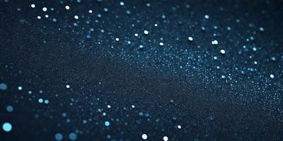 The primary subject of the image is a blue background with a pattern of bright, shiny stars. The setting appears to be a dark, starry night, with the stars being the main focus of the image. The visual style is a combination of a photo and digital art, creating a unique and captivating scene. The colors and mood of the image are predominantly dark and mysterious, with the bright stars providing a contrasting and eye-catching element.
