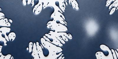 The primary subject of the image is a blue and white painting of a heart. The setting is a white background, and the visual style appears to be a digital art or illustration. The dominant colors are blue and white, creating a calm and serene atmosphere.