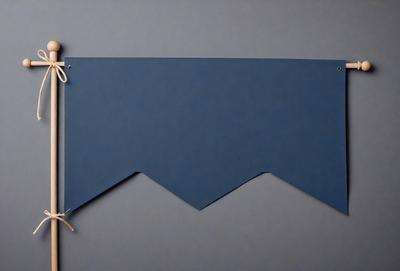 The primary subject of the image is a blue piece of fabric, possibly a curtain or a piece of art. The setting is a gray wall, which serves as the background for the blue fabric. The visual style of the image is a close-up, focusing on the blue fabric. The colors and mood of the image are predominantly blue, creating a calm and serene atmosphere.
