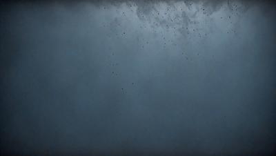 The primary subject of the image is a blue sky with a few black specks scattered throughout. The setting is a cloudy day, and the visual style appears to be a photo. The colors in the image are predominantly blue, with the black specks adding contrast. The overall atmosphere of the image is calm and serene.