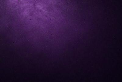 The image is a purple sky with a few stars visible. The sky is dark and the stars are scattered throughout the scene. The overall atmosphere is serene and peaceful.