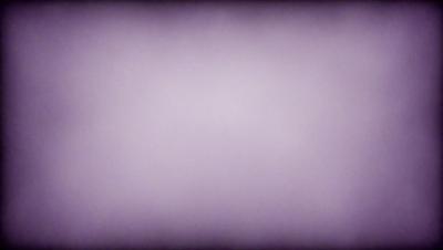 The primary subject of the image is a purple background. The setting is a white wall, and the visual style is a photo. The dominant colors are purple and white, creating a calm and serene atmosphere.