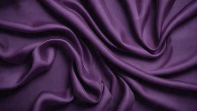 Purple fabric with a flowing pattern.