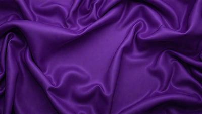 Purple fabric with a flowing texture.