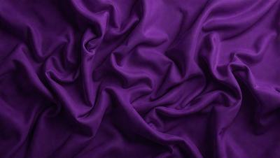 Purple fabric with a flowing texture.