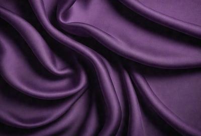 Purple fabric with a pattern of swirls and waves.