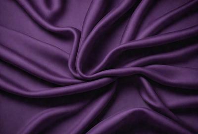 Purple fabric with a flowing pattern.