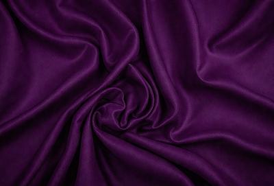 Purple fabric with a wrinkled texture.
