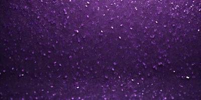 Purple glittery background with purple glittery stars.
