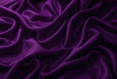Purple fabric with a flowing texture.