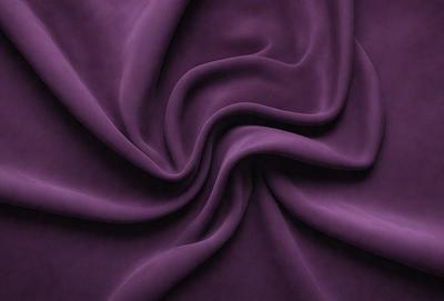 Purple fabric with a pattern of swirls and curves.