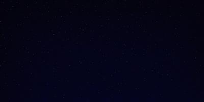 The primary subject of the image is the night sky, which is filled with a multitude of stars. The setting is a dark, star-filled night, with no visible landmarks or other objects. The visual style is a natural, nighttime scene, with the stars being the main focus. The colors and mood of the image are predominantly dark and serene, with the stars providing a sense of wonder and tranquility.