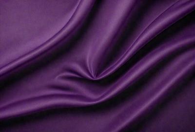Purple fabric with a flowing pattern.