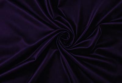 The primary subject of the image is a purple fabric, which is the main object, scene, or focus of the image. The setting or background is a dark purple fabric, and the visual style is a close-up of the purple fabric. The colors and mood of the image are predominantly purple, creating a calm and serene atmosphere.